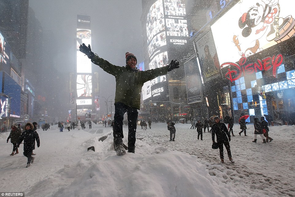 30841C3500000578-3413634-A_man_poses_for_a_photo_on_a_snow_pile_during_a_snow_storm_in_Ti-a-66_1453624633269