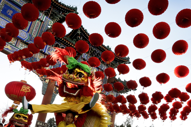 Performers participate in a lion dance at Ditan Park to mark the first day of Chinese Lunar New Year in Beijing, Monday, Feb. 8, 2016. Millions of Chinese began celebrating the Lunar New Year, which marks the Year of the Monkey on the Chinese zodiac. (AP Photo/Andy Wong)
