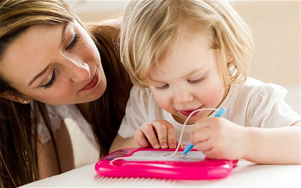 Mother and child writing/drawing...C1B3WA Mother and child writing/drawing