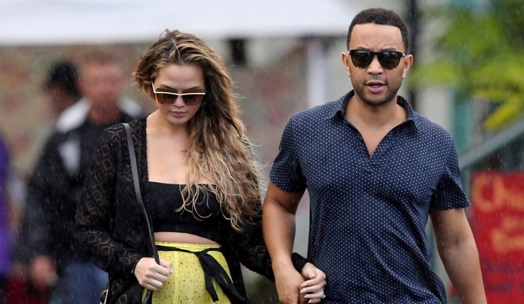 *EXCLUSIVE* ** RESTRICTIONS: WORLDWIDE EXCEPT IN AUSTRALIA, JAMAICA, MONACO, NEW ZEALAND, SCOTLAND, UNITED KINGDOM ** Hawaii, HI - *EXCLUSIVE* **SHOT ON 12/22/15** Hawaii, Hawaii - Chrissy Teigen shows off her baby bump in a crop top and loose fitting yellow pants as her and John Legend go out to sushi while on their holiday vacation in Hawaii.    12/24/2015  Copyright © 2014 AKM-GSI, Inc.      To License These Photos, Please Contact :  Maria Buda  (917) 242-1505  mbuda@akmgsi.com or    Steve Ginsburg  (310) 505-8447  (323) 423-9397  steve@akmgsi.com  sales@akmgsi.com