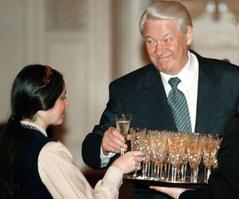 Russian President Boris Yeltsin (R) and an unidentified teacher take glasses of champagne during an awards ceremony in the Kremlin January 26, 1998. Yeltsin, who buried the Soviet Union then led Russia through its chaotic first years of independence, died on April 23, 2007 aged 76, the Kremlin said. REUTERS/Yuri Kadobnov/Pool/Files (RUSSIA)