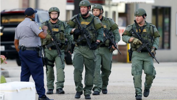 160718014535_law_enforcement_personnel_walk_near_the_scene_where_police_officers_were_shot_in_baton_rouge_640x360_reuters_nocredit