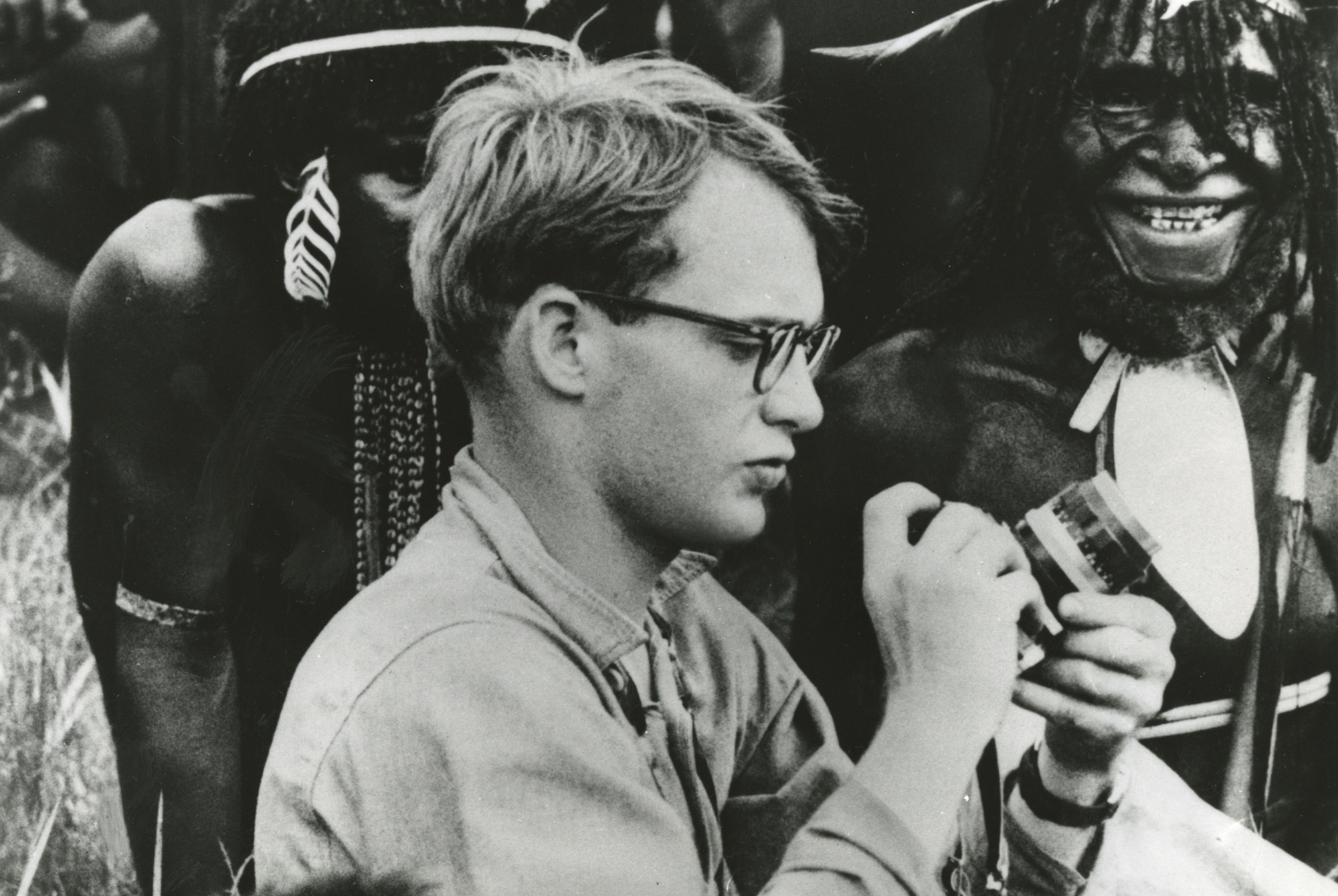 Michael C. Rockefeller, son of Nelson Rockefeller is shown as he adjusted his camera before taking pictures of Papuan men in New Guinea FOR RICK HOMAN PHOTO CREDIT: AP
