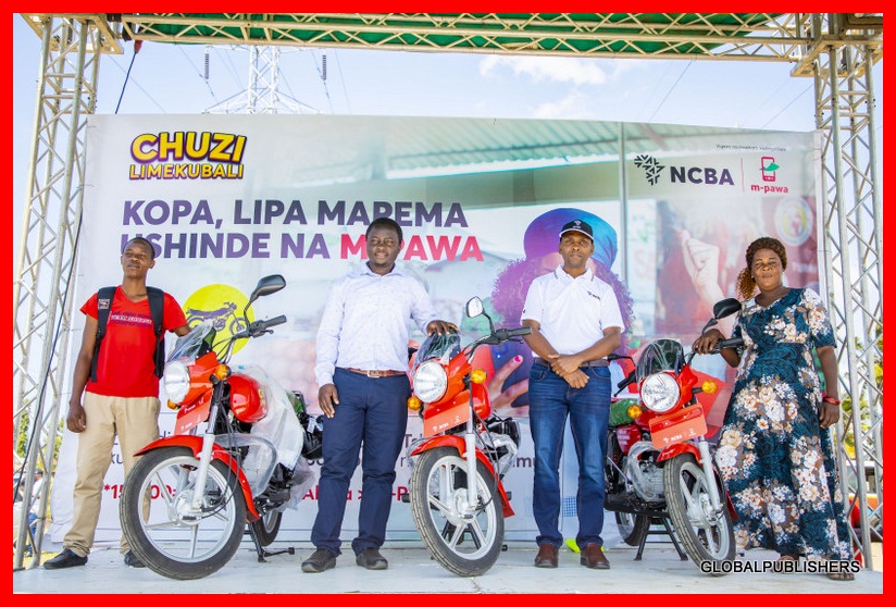 Washindi wa Kampeni ya MPawa Wakabidhiwa Pikipiki na Benki ya NCBA - Global Publishers