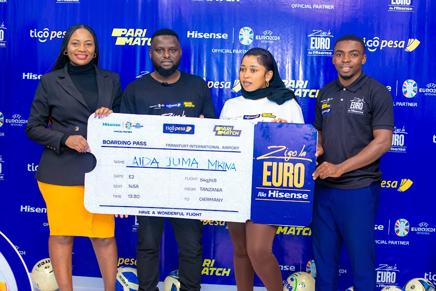 Aida Aibuka Mshindi Wa Zigo La Euro Na Hisense Kutoka Tigo, Akabidhiwa Tiketi Yake - Global Publishers